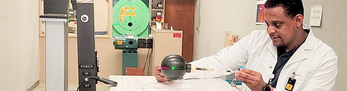 Radiation metrologist Omar Noor sets up a dosimeter for calibration in a photon beam used for radiation protection services at King Faisal Specialist Hospital and Research Center in Riyadh, Saudi Arabia