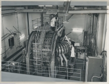 A view of the "ZETA" (Zero Energy Thermonuclear Assembly) fusion device which was operational between 1957 and 1968 at Harwell, United Kingdom. 
The transformer windings and the torus (or doughnut ring) can be seen. 
(IAEA Archives/Credit: UKAEA, United Kingdom)