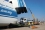 Truck drives up the ramp into the compartment part of the AN-124 cargo plane. The truck will stay in the plane and travel with the over-package to Russia. (Photo: S. Tozser/IAEA)
