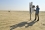 The cosmic ray neutron sensor provided by the IAEA, under its technical cooperation programme, is set up at the KISR laboratory field study. Abdullah Salem Alshatti, the principal researcher at the KISR Desert Agriculture and Ecosystem Program, is checking the battery and the working condition of the cosmic ray neutron sensor.