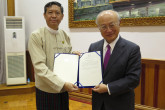 IAEA Director General Yukiya Amano together with Union Minister for Education Dr Myo Thein Gyi,, shows the Instrument of Accession to the RCA (The Regional Cooperative Agreement for Research, Development and Training Related to Nuclear Science and Technology for Asia and the Pacific), during his official visit to Myanmar on 29 June 2017.
