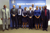 IAEA Director General Yukiya Amano poses for a group photo with the staff of the Radiation Protection Inspectorate, during his official visit to Botswana. 26 January 2018
