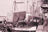 The mobile isotope lab being hoisted on a ship to travel from Montevideo (Uruguay) to Rio de Janeiro (Brazil). 1961. Please credit IAEA