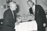 The Head of the US delegation to the IAEA, Robert McKinney (right) describing the equipment inside a model of one of the mobile labs to the Director General of the IAEA, William Sterling Cole (left). 29 April 1958. Please credit IAEA