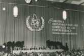 View of the podium during the opening session of the first Fusion Energy Conference at the Europahaus in Salzburg, Austria, 4 September 1961. 
L.t.r.: Bronislaw Buras, Bechir Torki, Evgueni Piskarev, Claude Etievant, Arkady Rylov, Hans Lechner, Sterling Cole (IAEA Director General, 1957-1961), Alfred Baeck, Bernhard Gross, Philip Davenport, Wilhelm Gauster and Witold Lisowski. 
(IAEA Archives/Credit: Photo Ellinger)