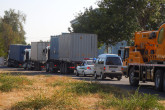 The convoy on the road from the Radiation and Technological Complex to Tashkent International Airport. The container with the HEU fuel in the truck right in front of the police car. (Photo: S. Tozser/IAEA)