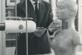 A dummy being used to demonstrate the accurate measurement of radioiodine uptake by the thyroid gland. The photo shows the distance being measured between the mock thyroid of the dummy and the crystal of a scintillation detector. December 1961. Please credit IAEA.