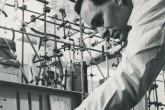IAEA staff member Lincoln Engelbert operating a scaler on the apparatus for the separation of tritium and hydrogen by gas chromatography at the IAEA laboratory in Seibersdorf. April 1964. Please credit IAEA