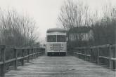 Crossing a wooden bridge on the border between Yugoslavia and Greece, April 1959 (today North Macedonia – Greece border). The Mobile Isotope Laboratory was sent to Athens to help with research in disease diagnosis at the Isotope Laboratory of the Alexandra Hospital.  April 1959. Please credit IAEA