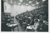 The opening of the 2nd Fusion Energy Conference in Culham, United Kingdom, 6-10 September 1965, with Sir John Cockcroft, Master of Churchill College, welcoming the delegates. 
Delegates from 26 countries fill the Culham Lecture Theatre. 
(IAEA Archives/Credit: UKAEA, United Kingdom)