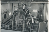 A view of the "ZETA" (Zero Energy Thermonuclear Assembly) fusion device which was operational between 1957 and 1968 at Harwell, United Kingdom. 
The transformer windings and the torus (or doughnut ring) can be seen. 
(IAEA Archives/Credit: UKAEA, United Kingdom)