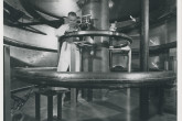 The interior of the Gulf General Atomic's (today General Atomics) direct current octupole plasma confinement device during final construction. 
The magnetic field was produced by current flowing in four rings — a technician is shown installing the innermost ring; the other three are indicated by arrows.
The device, housed in a tank 8 feet high, by 16 feet in diameter, provide large volume of magnetically confined plasma. 
(IAEA Archives/Credit: Photo: USAEC/San Francisco, Operations Office, USA)