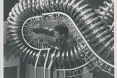 An engineer from Princeton University assembling the figure 8-shaped stellarator model at the US fusion exhibit in Geneva as part of the Second United Nations International Conference on the Peaceful Uses of Atomic Energy, Geneva, Switzerland, September 1958.
(IAEA Archives/Credit: UN Photo/Mark Garten)