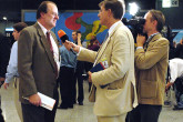 A journalist gauges the staff reaction following the IAEA's Nobel Peace Prize win. (Vienna International Centre, Vienna Austria, 7 October 2005) 