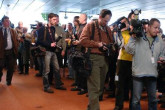 Reporters wait outside the IAEA Board room, where the 35-member policymaking body meets at the Agency&acute;s headquarters in Vienna. (Photo Credit: D. Calma/IAEA)