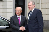 The Belgian Prime Minister, Yves Leterme, greets IAEA Director General Yukiya Amano upon his arrival at the Prime Minister's official residence in Brussels, 19 May 2011.