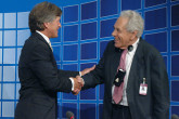 IAEA Deputy Director General David Waller congratulating the President of the Conference, Mr. A. Baer from Switzerland. (Credit: D. Calma/IAEA)