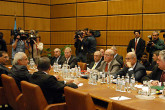 Film crews and photographers were allowed in the
meeting room before the closed door talks began. Photo Credits: Dean Calma/IAEA Oct 2002