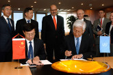 The IAEA promotes legally-binding conventions, international safety standards and peer reviews to ensure that nuclear and radiation techniques are used safely, with proper protection of people and the environment. Above, China signs a nuclear security cooperation agreement with the IAEA.  (Photo Credit: Dean Calma)