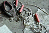Kopachi's kindergarten is the only building that survived the demolition of the village. Toys lie strewn around its abandoned rooms. 