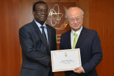 The new Resident Representative of Togo, Kwami Christophe Dikenou,  presents his credentials to IAEA Director General Yukiya Amano in Vienna, Austria on 16 June 2015.