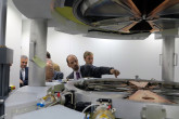 IAEA Director General Yukiya  Amano tours the offices of IBA, a high technology medical company in Brussels specializing in proton therapy, radiopharmacy, particle accelerators and dosimetry, on 12 November 2015 during his official visit to Belgium. 
