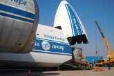 Truck half-way in the plane. (Photo: S. Tozser/IAEA)