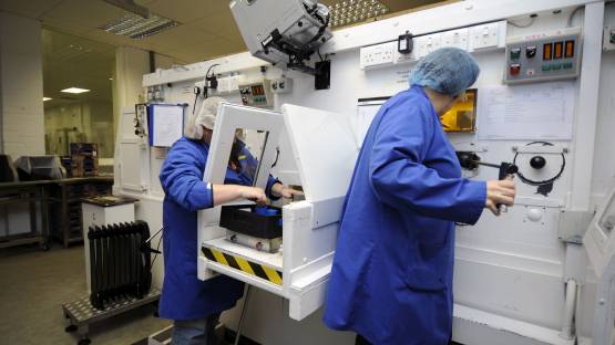 Experts packing radio-pharmaceuticals at a facility in Amersham, United Kingdom. (Photo: D.Calma/IAEA)