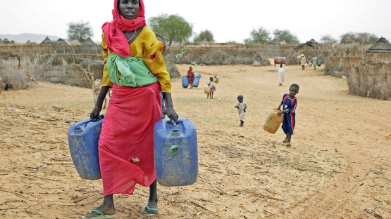 women collecting water africa