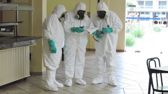 emergency men in hazard suits