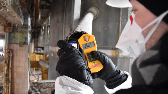 As part of the decommissioning and environmental remediation works, an expert measures radioactivity levels at the former uranium production facilities at the Pridneprovsky Chemical Plant in Ukraine.