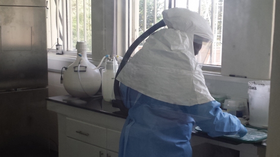 Technician working in the BSL-3 laboratory of the Centre for Disease Control/Uganda Virus Research Institute (CDC/UVRI)